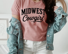 Load image into Gallery viewer, Person wearing a pink 'Midwest Cowgirl' t-shirt with a denim jacket.