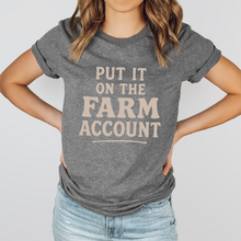 Load image into Gallery viewer, Person wearing a gray t-shirt with 'Put it on the farm account' text.