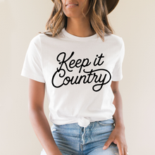 Load image into Gallery viewer, Person wearing a white t-shirt with 'Keep it Country' text on a plain background